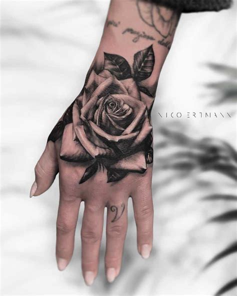 3roses tattoo|rose hand tattoo.